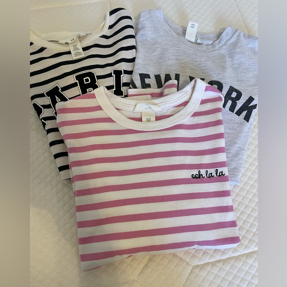 3 size XS H&M shirts. 2 short sleeve 1 long sleeve.